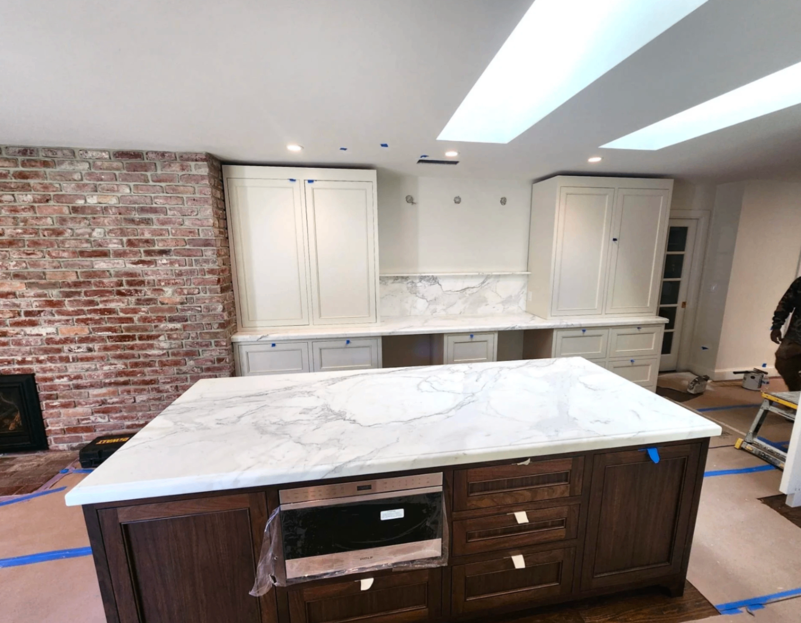 Bright white marble island with crisp edge profile
