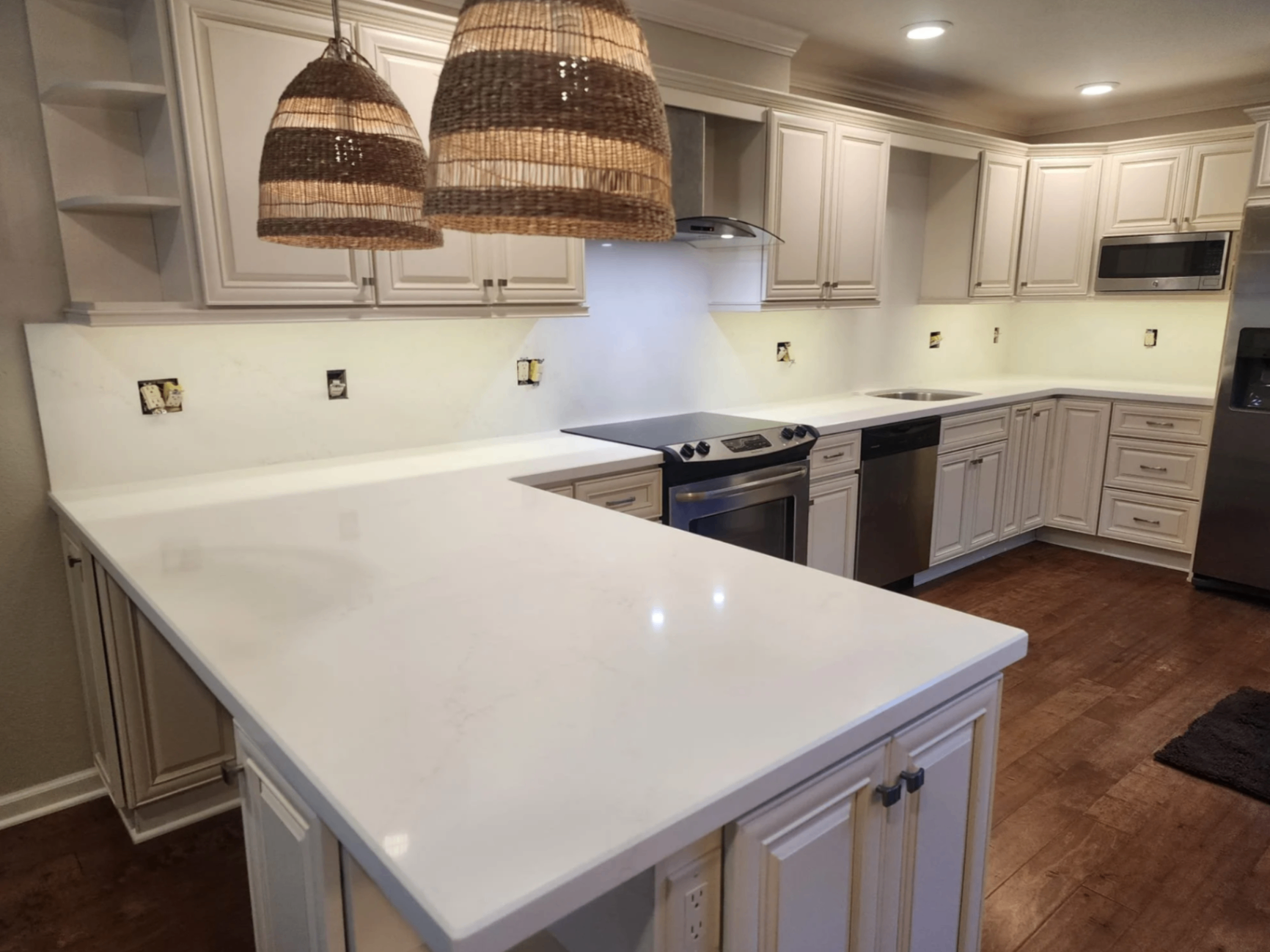 Quartz countertop with matching full-height backsplash